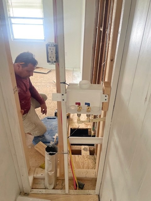Exposed mobile home wall framing during repair