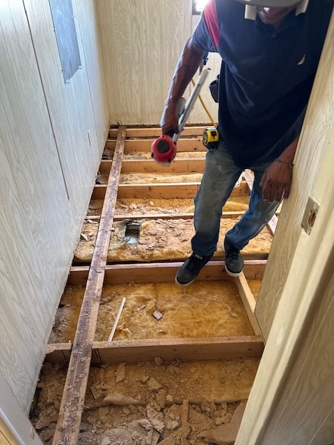 Floor joists exposed during a mobile home subfloor repair